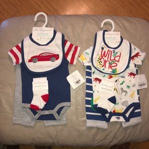 Two 4 piece set newborn layettes from Dillard’s